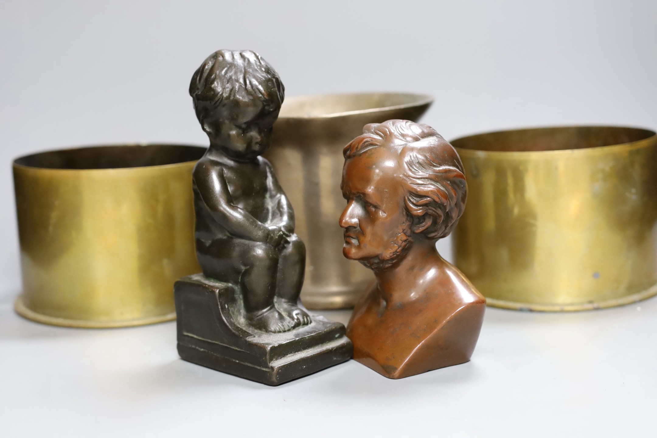 A weighted brass lion paperweight , bronzed bust, mortar, shell cased etc (6) tallest 14.5cm